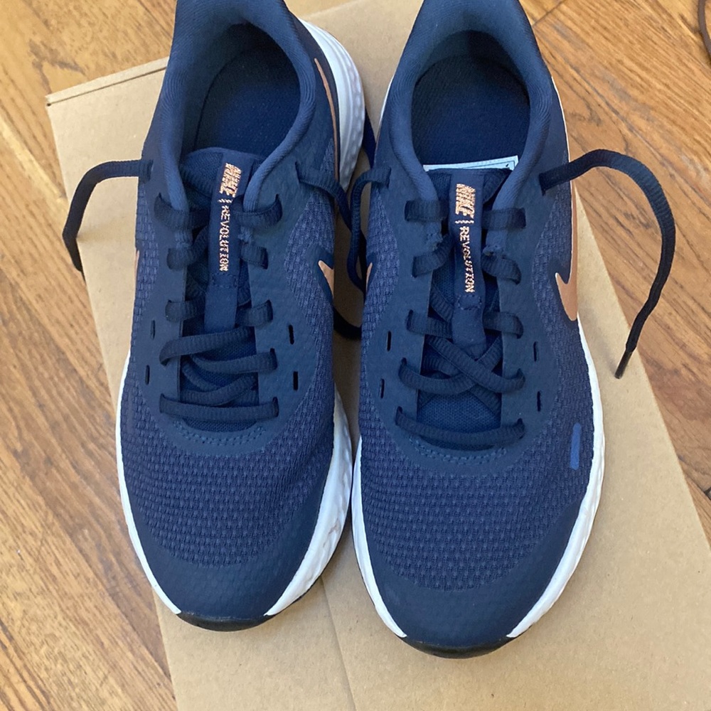 Nike Revolution Navy with Rose/gold/ tannish swosh.. size4.5y for Girl